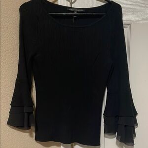 Black fitted blouse with bateau neckline and 3/4 ruffled sleeves
